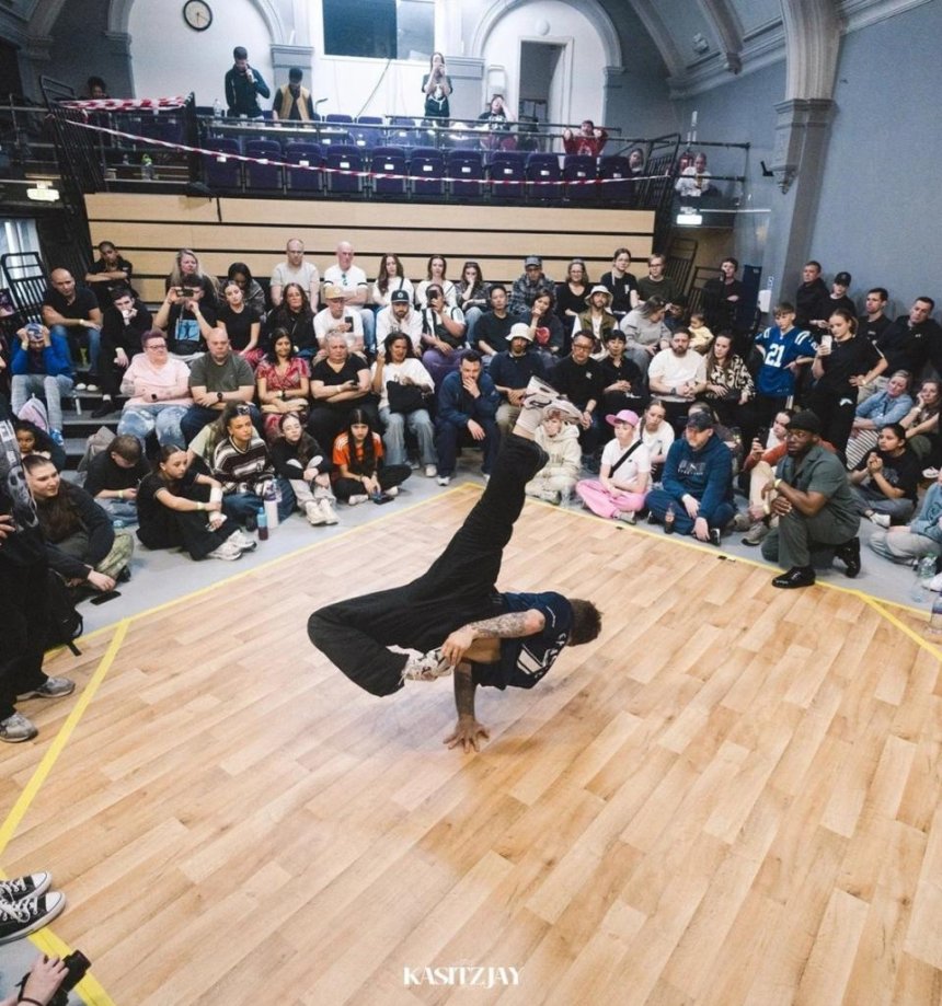Audience watching a breakdancer